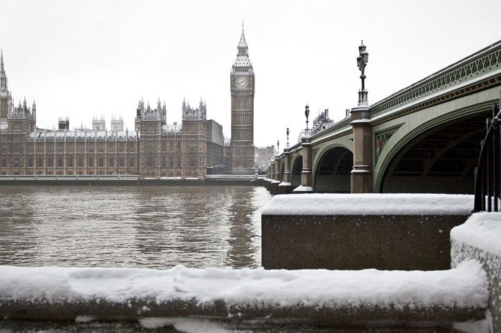 A snowy view of Big Ben and Westminster Palace in London, England.